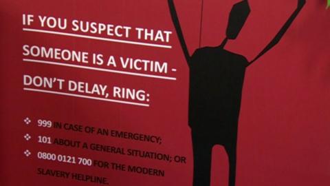 Modern slavery poster appealing for public assistance