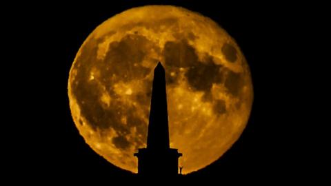 The Hunter's Super Moon rise above Stoodley Pike in Todmorden, Yorkshire.