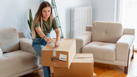 Woman unpacking boxes