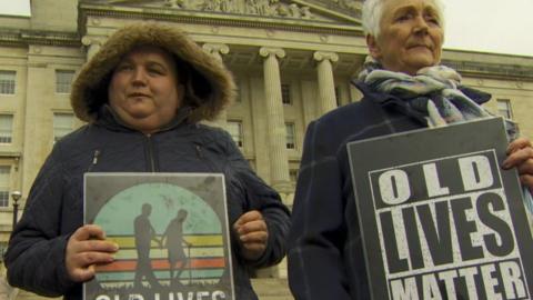 protestors at Stormont over care home rules