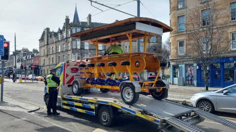 The bike on the back of a lorry on Leith Walk