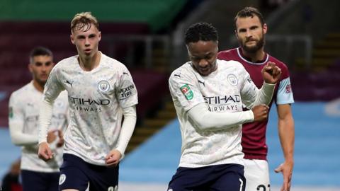 Raheem Sterling celebrates scoring for Manchester City against Burnley in the Carabao Cup