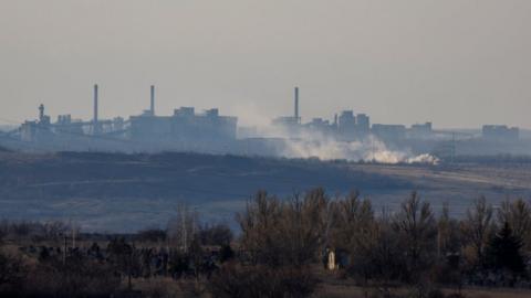 Smoke rises near the Avdiivka Coke and Chemical Plant in the town of Avdiivka in the course of Russia-Ukraine conflict, as seen from Yasynuvata (Yasinovataya) in the Donetsk region, Russian-controlled Ukraine, February 15, 2024