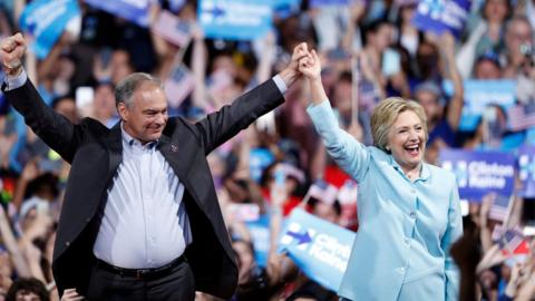 Democratic presidential candidate Hillary Clinton arrives with Sen. Tim Kaine, D-Va., at a rally at Florida International University Panther Arena in Miami, Saturday, July 23, 2016. Clinton has chosen Kaine to be her running mate.