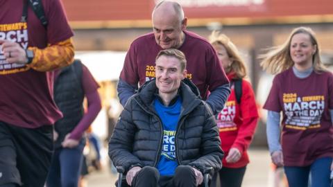 Former football player Stephen Darby, who has been diagnosed with motor neurone disease, setting off from Bradford City Football Club's stadium