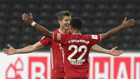 Robert Lewandowski and Serge Gnabry celebrate