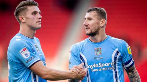 Coventry City's Viktor Gyokores (left) and Kyle McFadzean (right)