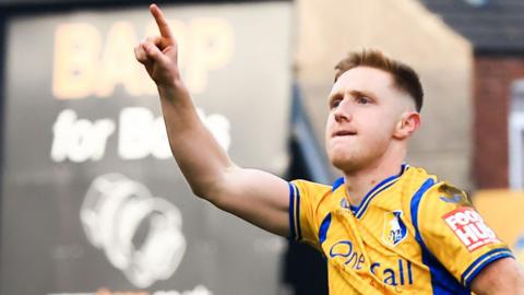 Davis Keillor-Dunn celebrates after scoring Mansfield's second goal against Swindon