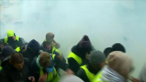 Protesters flee after police fire tear gas