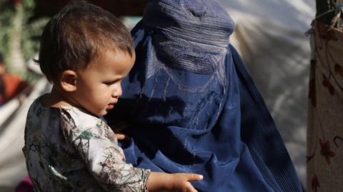 Woman and child, internally displaced in Kabul after fleeing the Taliban insurgency