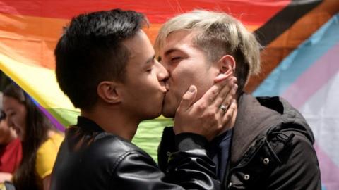 Santiago Maldonado and Jorge Esteban Farias kiss as part of a protest after being assaulted by people while kissing in a public park, in Bogota, Colombia July 31, 2022.