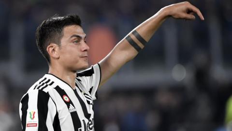 Juventus striker Paulo Dybala directs his team-mates