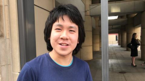 Amos Yee, 18, stands outside the United States Citizenship and Immigration Services offices after his release from detention in Chicago, Illinois, US, 26 September 2017.