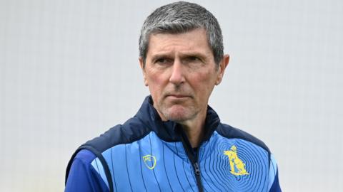 Warwickshire first-team coach Mark Robinson looks on during practice