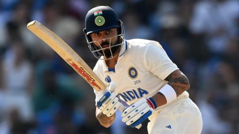 India batter Virat Kohli watches the ball after hitting a shot against Australia