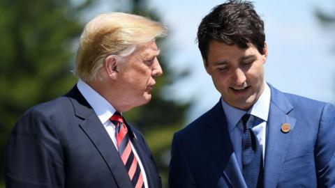 Prime Minister of Canada Justin Trudeau speaks with US President Donald Trump during the G7 official welcome at Le Manoir Richelieu on day one of the G7 meeting on 8 June, 2018 in Quebec City, Canada