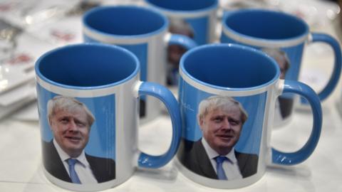 Boris Johnson's images on mugs on sale at Manchester Tory Party conference