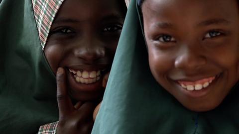 Schoolgirls smiling