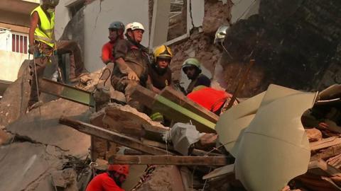 Rescuers in Beirut search rubble for a survivor of the blast