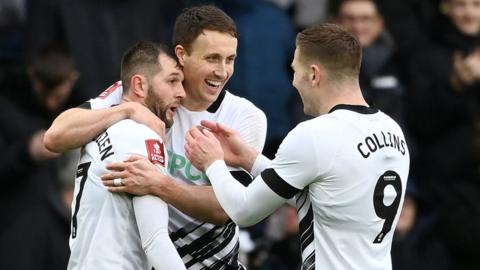 James Collins joins Tom Barkhuizen in celebrating Derby's second goal against Barnsley