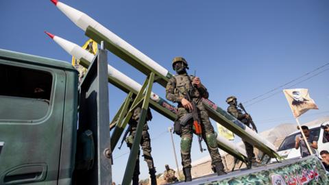 Al-Quds Brigades, the military wing of Islamic Jihad, participate in an anti-Israel military parade with rockets mounted on trucks in Rafah, southern Gaza Strip, 24 August 2022