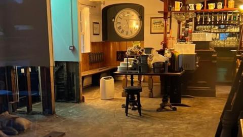 Damaged floor inside a pub