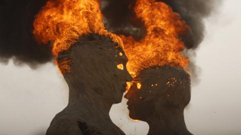 The art installation Embrace burns during the Burning Man 2014
