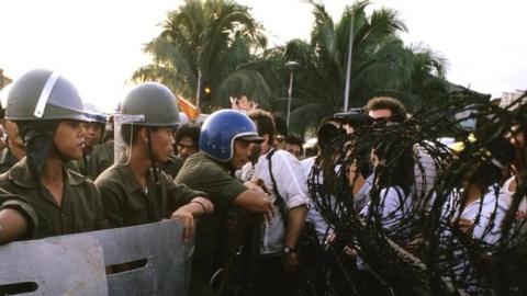 Soldiers face off with people power pro-democracy protesters in the Philippines in 1986.