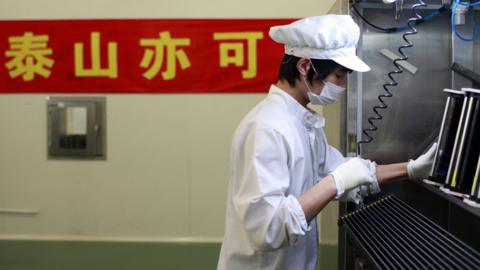 A worker in solar panel factory in China