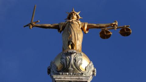 Statue on top of the Central Criminal Court