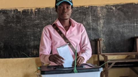 A voter casts his ballot at a polling station at the Hedzranawoe public primary school in Lome on April 29, 2024, during Togo's legislative elections.