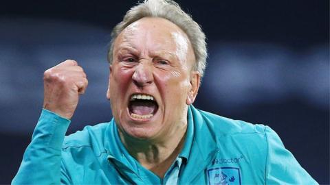 Neil Warnock celebrates the Huddersfield equaliser