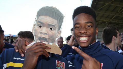 Ivan Toney with a cardboard cut out Ivan Toney from his days as a Northampton Town player in 2014