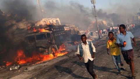 Image shows civilians evacuating from the scene of an explosion in the Hodan district of Mogadishu, Somalia on 14 October 2017