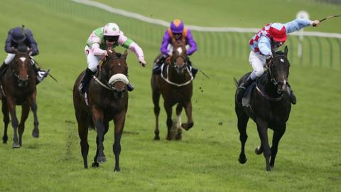 Neil Callan rides Amadeus Wolf (L) to win The Shadwell Stud Middle Park Stakes run at Newmarket Racecourse, on September 30, 2005 in Newmarket, England.