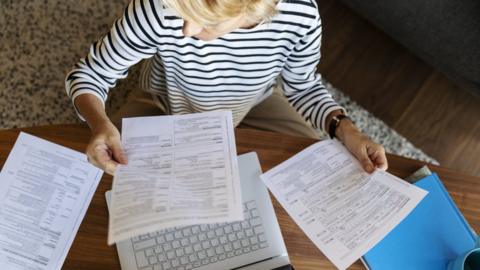 Woman working on bills