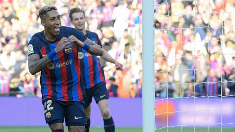 Barcelona forward Raphinha celebrates his match-winning goal against Valencia