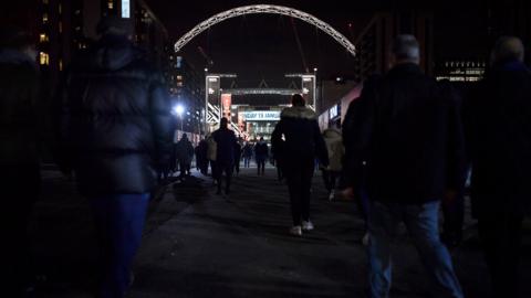 Fans walk towards Wembley