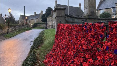 Knitted poppies at Gretton war memorial
