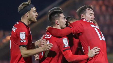 Crewe celebrate a goal against Swindon