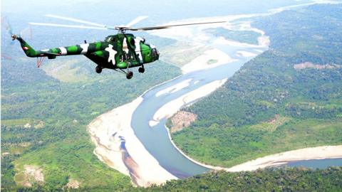 Peruvian Army helicopters overfly the tactical VRAEM area, between the rivers Ene, Apurimac and Mantaro, some 280 km south east of Lima, on August 5, 2015, as part of operations against terrorism and drug trafficking in the region