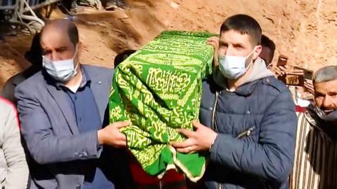 The coffin of 'Little Rayan' being carried at his funeral