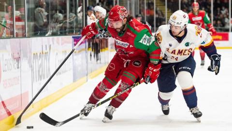 Stephen Dixon battles for position for Cardiff Devils against Guildford Flames