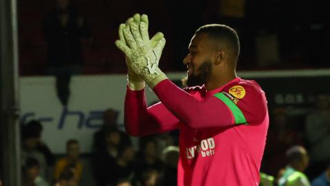 Ellery Balcombe of Brentford applauds the fans at the end of the penalty shoot out