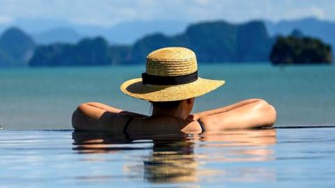 Woman in pool in Thailand