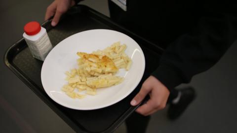 school child with lunch tray