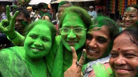 Supporters of Trinamool Congress (TMC) celebrate vote counting results for India's general election outside the Chief Minister's residence in Kolkata on June 4, 2024