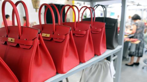 File image of luxury handbags on a shelf