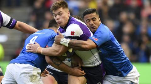 Huw Jones of Scotland is tackled against Samoa