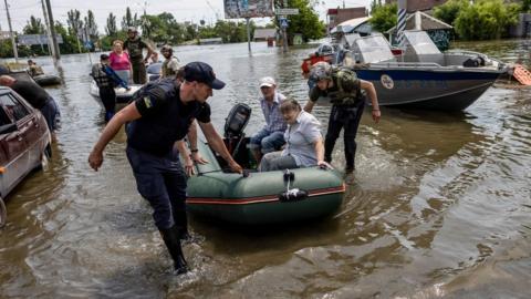 Evacuation workers in Kherson